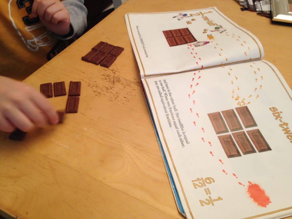 a student using a hershey bar book to learn equivalent fractions