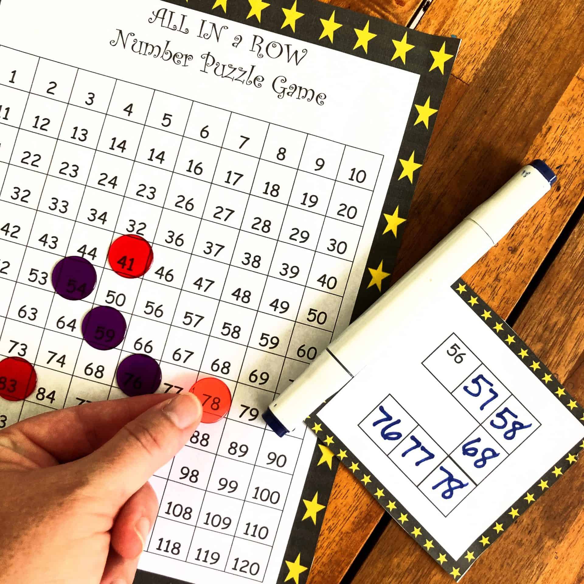 Number puzzles for kids with game pieces on it and playing cards.