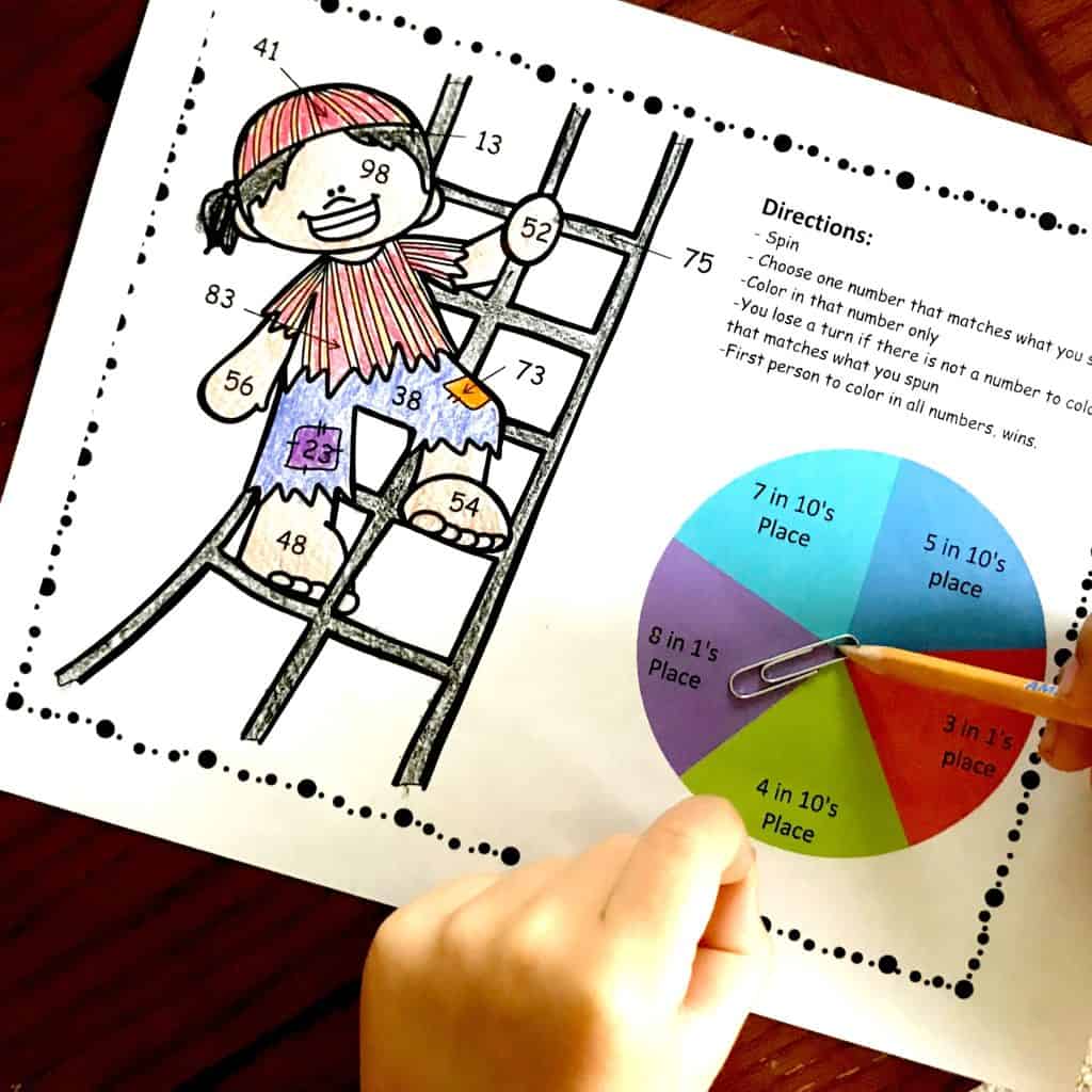 Place value color by number worksheets with a pirate climbing a latter that is colored in with crayons. 