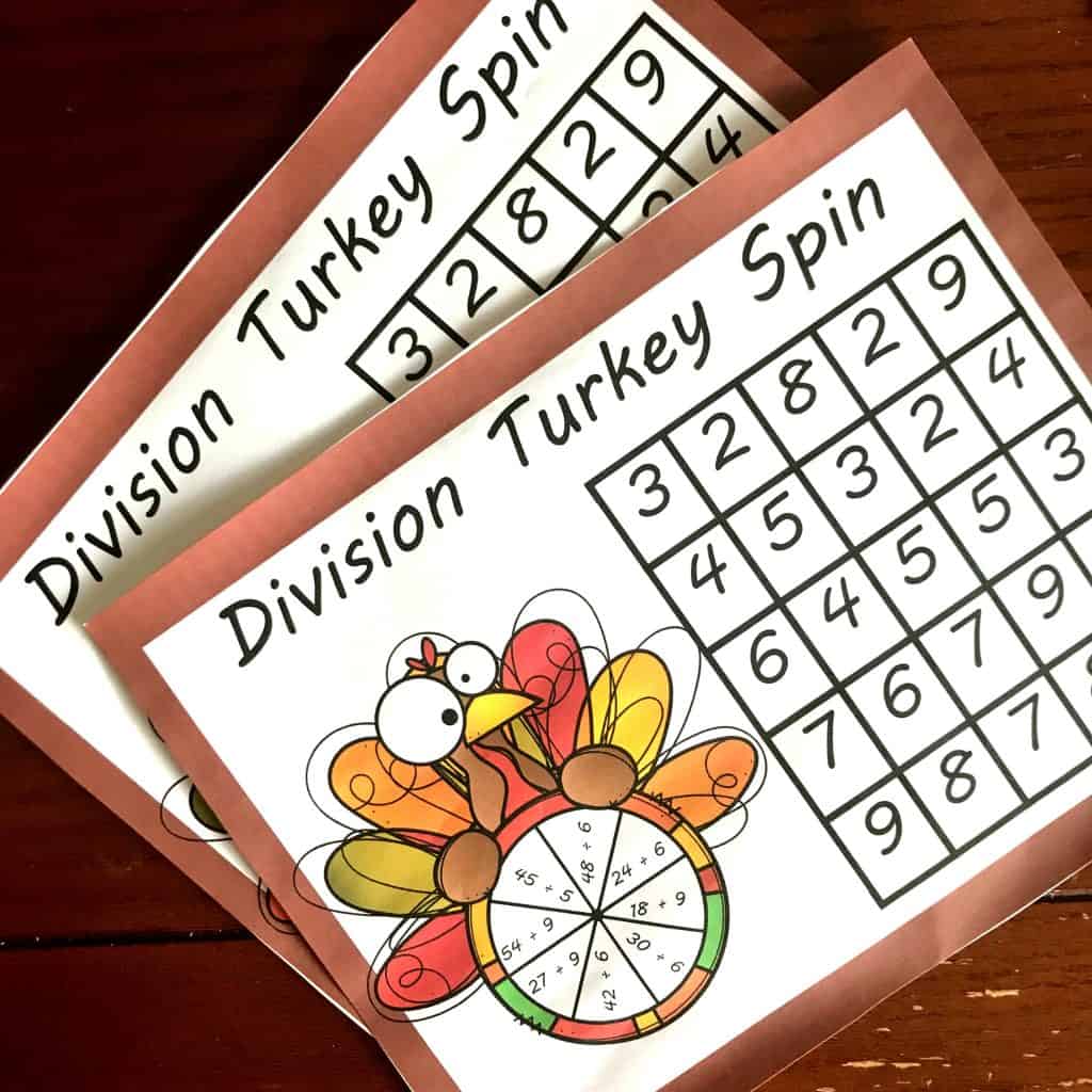 Thanksgiving Division Game printable with game pieces on a wooden background. 