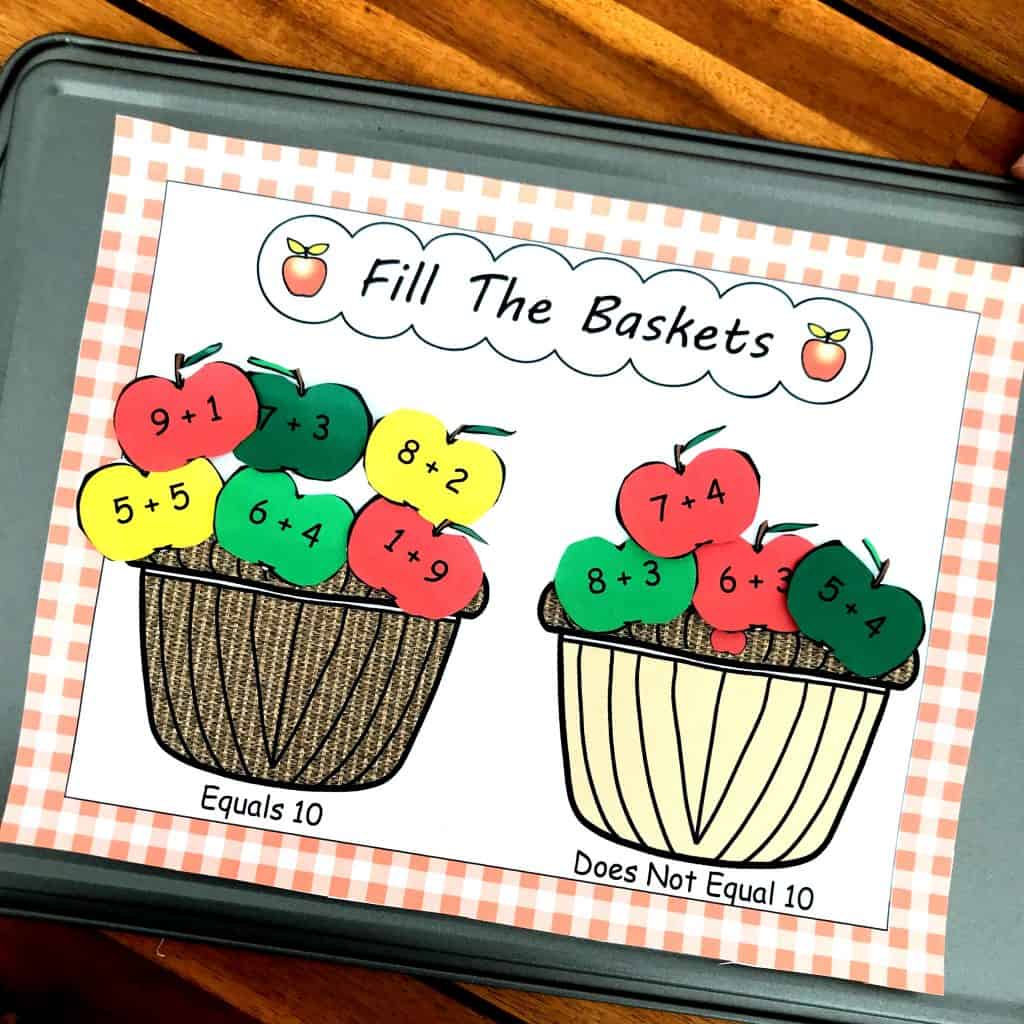 Addition within 10 worksheet with a hand placing an apple in a basket. 